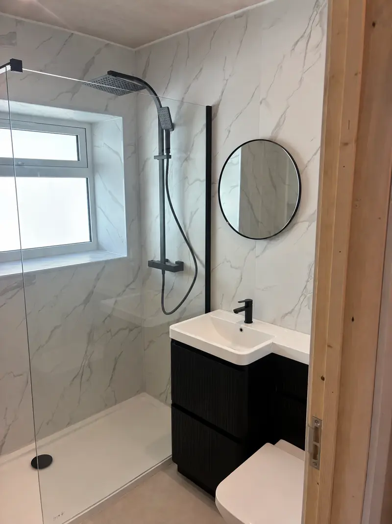Armison bathroom with shower and vanity; basin tap digitally visualised