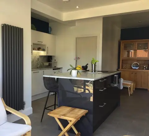Armison kitchen with a fitted island and seating
