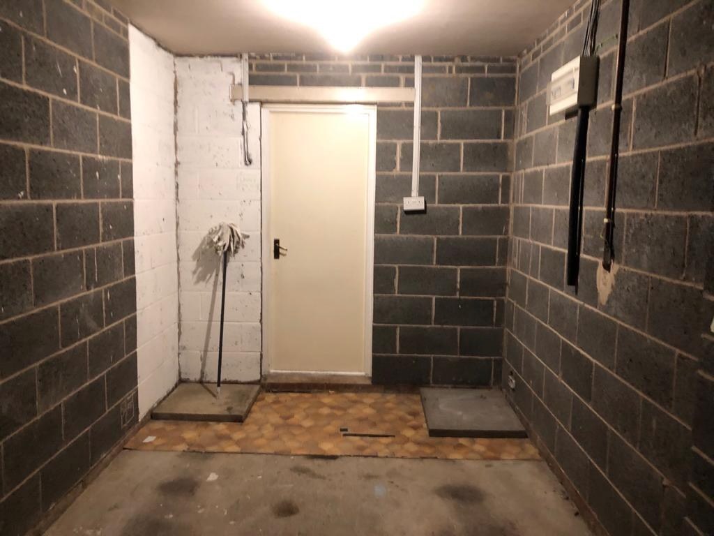 Utility area during work, showing exposed blockwork